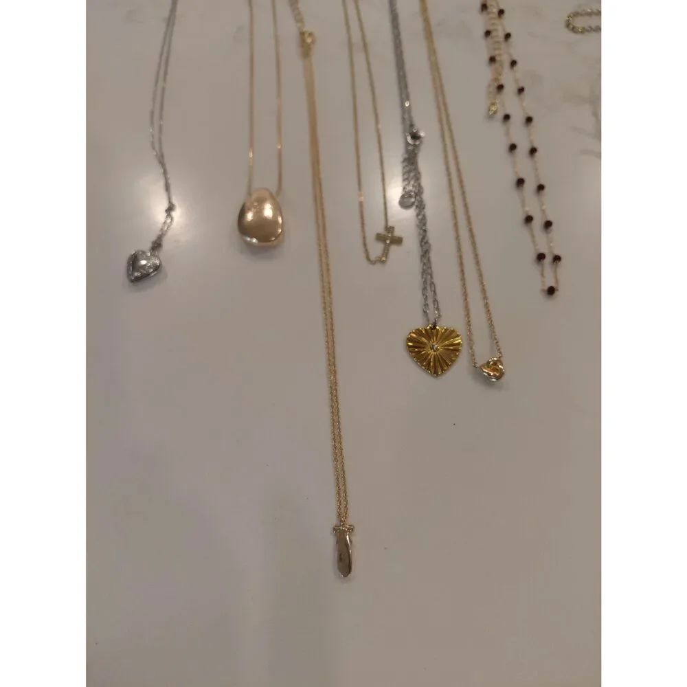 4 sets of earrings, 4 bracelets, and 7 necklaces which are all new.